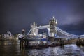 Night view of the skyline of London with a cruise ship passing under the lifted Tower Bridge Royalty Free Stock Photo