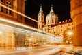 Night view of St. Nicolas Church, Prague, Czech republic. Long exposure city lights.Motion speed scene.Traffic trails in town.City Royalty Free Stock Photo