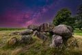 Night view with starry sky in a clear sky of the remains of a Megalithic burial monument, Hunebed D15 Royalty Free Stock Photo