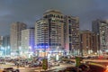 Night view of street with skylines and neon lights of Abu Dahbi, United Arab Emirates