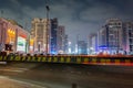 Night view of street with skylines and neon lights of Abu Dahbi, United Arab Emirates