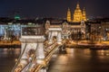 Night View of the Szechenyi Chain Bridge and church St. Stephen`s in Budapest Royalty Free Stock Photo