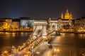 Night View of the Szechenyi Chain Bridge and church St. Stephen's in Budapest Royalty Free Stock Photo