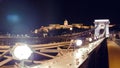 view of the Szechenyi Chain Bridge that spans the Danube between Buda and Pest. Royal Castle at the opposite bank of the Royalty Free Stock Photo