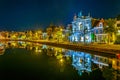 Night view of Teylers museum situated next to a channel in the dutch city Haarlem, Netherlands