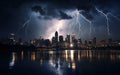 Night view of a thunder storm over a city at night with lightning strikes reaching the skyscrapers on the skyline. Royalty Free Stock Photo