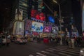 Night view of Time Square on Broadway in New York with people walking around. NY. USA. Royalty Free Stock Photo