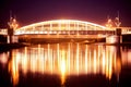 Night view to a bridge over river Warta in Poznan, Beautiful lights and reflections in calm water