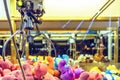 Night view to claw machine full of colorful soft toys