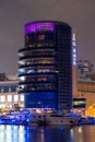 Night view to Dubai Marina panorama, reveals Pier 7 and boats. Luxury destination for tourists and residents.