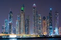 Night view to Dubai panorama. Amazing illumination of the modern iconic skyscrapers at twilights. Shot at blue hour.