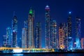 Night view to Dubai panorama. Amazing illumination of the modern iconic skyscrapers at twilights. Shot at blue hour. Royalty Free Stock Photo