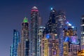 Night view to iconic skyscrapers skyline of Dubai Marina. Amazing illumination of the buildings. Royalty Free Stock Photo