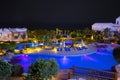 Night view to the swimming pool, building and palm trees on the beach near the red sea in Sharm El Sheikh, South Sinai, Egypt Royalty Free Stock Photo