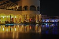 Night view to the swimming pool and palm trees on the beach near the red sea in Sharm El Sheikh, South Sinai, Egypt Royalty Free Stock Photo