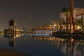 Night view to the swimming pool and palm trees on the beach near the red sea in Sharm El Sheikh, South Sinai, Egypt Royalty Free Stock Photo