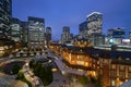 The night view of The Tokyo Station with the skyscrapers of marunouchi under a blue evening sky. Photoed in Tokyo, Japan. Royalty Free Stock Photo