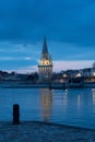 Night view of the Tour de la lanterne in La Rochelle, France. beautiful reflections in the harbor water