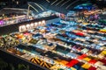 Night view of the Train Night Market Ratchada, also known as Talad Nud Rod Fai, is a new flea market place at Bangkok, Thailand.