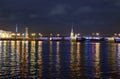 Night view of the University embankment of St. Petersburg through the Neva River- Peter and Paul fortress, Palace bridge, Vasilie Royalty Free Stock Photo