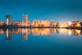 Night View Of Urban Residential Area Overlooks To City Lake Or River And Park In Evening Illumination, Reflecting In Royalty Free Stock Photo