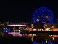 Night view of Vancouver Science World and BC Place Stadium with skyline reflected in the smooth water of False Creek bay. Royalty Free Stock Photo