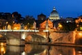 Night view of Victor Emmanuel bridge over Tiber river with St. Peter`s Cathedral dome at background, Rome, Italy Royalty Free Stock Photo