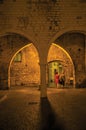 Night view of walls and stone arches in Vence.