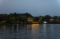 Night view of West Lake, freshwater lake in Hangzhou, China. It is divided into five sections by three causeways. There are