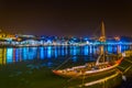 night view of a wooden boat used for transport of wine anchoring along riverside of Douro in Porto, Portugal Royalty Free Stock Photo