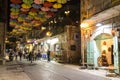 Night view of Yoel Moshe Salomon Street in Jerusalem decorated with brightly colored