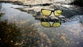 Night vision glasses with the water reflection covered by the natural background view Royalty Free Stock Photo