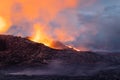 Night volcanic eruption. Fresh hot lava, flames and poisonous gases going out from the crater