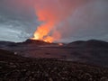 Night volcanic eruption. Fresh hot lava and poisonous gases going out from the crater