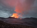 Night volcanic eruption. Fresh hot lava and poisonous gases going out from the crater