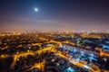 Night Voronezh aerial cityscape from rooftop. Residential area. Moon above city