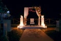 Night wedding ceremony, beautiful decor with candles