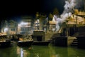 Night wide angle shot at the cremation ghats in the sacred town of Varanasi hindus burn the dead people to prevent them from