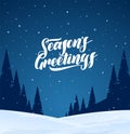 Night winter snowy landscape with hand lettering of Season`s Greetings and pines forest. Christmas background Royalty Free Stock Photo