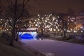 RIGA, LATVIA - JANUARY 14, 2018: Night winter view of the Bastion Hill town park and Alexander bridge in historical part of Riga