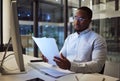 Night worker, black businessman and paperwork planning, reading documents and financial reports at desktop computer in Royalty Free Stock Photo
