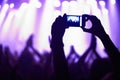 Nightclub, concert and audience with phone or lights for music, party and rave festival with silhouette and dancing