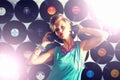 Nightclub, DJ and portrait of woman with headphones for listening to music with vinyl on wall. Techno, rave and musician Royalty Free Stock Photo