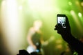 Nightclub, festival and audience with phone or lights for music, party and rave concert with silhouette and band. Disco Royalty Free Stock Photo