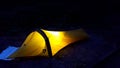 Nightime tent with light on inside