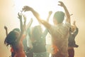 Nightlife and disco concept. Young people are dancing in club. Royalty Free Stock Photo