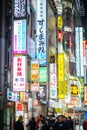 Nightlife in Kabukicho, the entrance of Kabukicho entertainment Red Light district in Shinjuku Ward, Tokyo. Billboards and Crowd