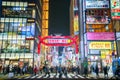 Nightlife in Kabukicho, the entrance of Kabukicho entertainment Red Light district in Shinjuku Ward, Tokyo. Billboards and Crowd