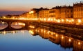 Nightlight over Ponte Santa Trinita, Arno river and the right bank of the Arno river, seen from Ponte alla Carraia in Florence.