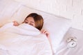 Nightmare or bad dream,Asian woman with fear and panic while lying down under the blanket in bedroom